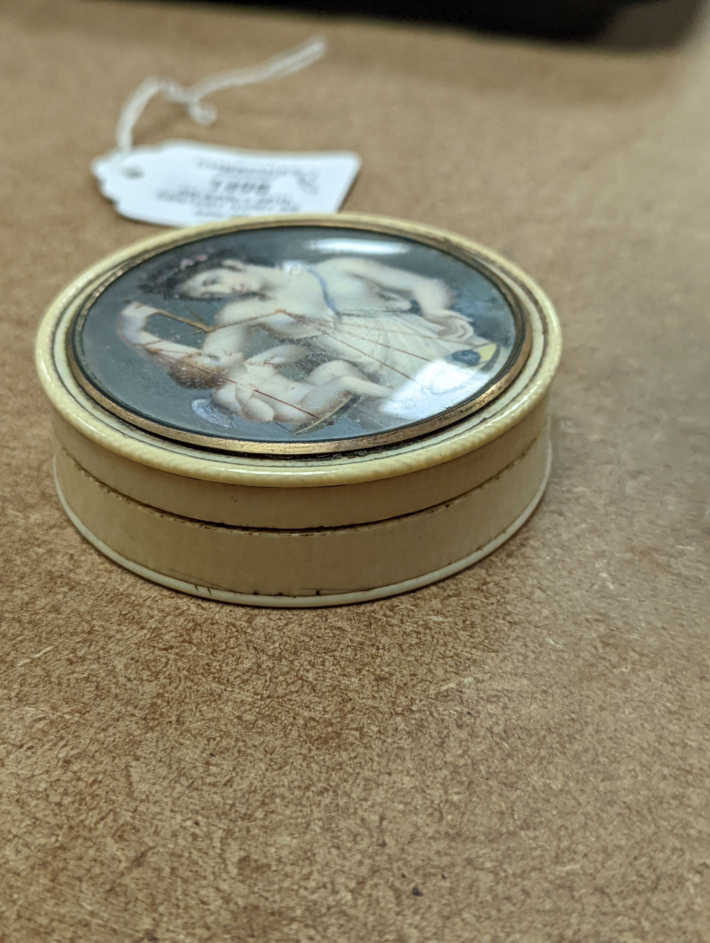 An early 19th century ivory and tortoishell box with inset miniature of Themis to cover, 8cm.